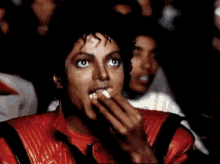 Michael Jackson Watching A Movie And Eating Popcorn GIF - Popcorn Movie Watching GIFs